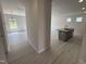 Open concept living room with a kitchen island, modern lighting, and lots of natural light at 67 Commons Cir, Clayton, NC 27520
