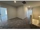 A well-lit loft space with neutral walls and carpeted floors, ready for customization at 67 Commons Cir, Clayton, NC 27520