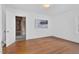 Cozy bedroom with wood floors and art, plus a glimpse into an adjacent space at 701 E Nash St, Spring Hope, NC 27882