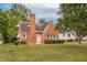 Charming brick home featuring a well-maintained front yard and a classic architectural design at 701 E Nash St, Spring Hope, NC 27882