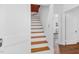 Stairway featuring wood steps and white risers that leads to an upper level at 701 E Nash St, Spring Hope, NC 27882