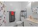 Bathroom showcasing a sink, toilet, shower with character-themed curtains and a storage shelf at 704 Benchmark Dr, Raleigh, NC 27615