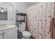 Compact bathroom featuring a toilet, sink and shower with cute bunny shower curtain at 704 Benchmark Dr, Raleigh, NC 27615
