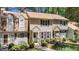 Inviting townhome with charming front entrances, well-maintained landscaping and walkways at 704 Benchmark Dr, Raleigh, NC 27615