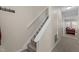 Hallway featuring the staircase and an open view of the living room at 704 Benchmark Dr, Raleigh, NC 27615