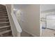 Hallway featuring the staircase, a closet, and an open view of the kitchen at 704 Benchmark Dr, Raleigh, NC 27615