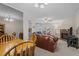 Cozy living room with fireplace, plush seating, and natural light at 704 Benchmark Dr, Raleigh, NC 27615