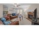 Inviting living room boasts a brick fireplace, plush leather seating, and neutral decor at 704 Benchmark Dr, Raleigh, NC 27615