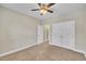 Bedroom featuring neutral carpet and paint, a ceiling fan and double closets at 711 Providence Glen Dr, Chapel Hill, NC 27514