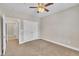 Bedroom featuring neutral carpet and paint, a ceiling fan and double closets at 711 Providence Glen Dr, Chapel Hill, NC 27514