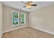 Bedroom featuring neutral carpet and paint, a ceiling fan and bright natural light at 711 Providence Glen Dr, Chapel Hill, NC 27514