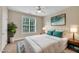 Bright bedroom with a neutral color palette, large window, and stylish decor at 711 Providence Glen Dr, Chapel Hill, NC 27514