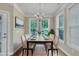 Bright dining room with a chandelier, a large table, and plenty of natural light streaming through the windows at 711 Providence Glen Dr, Chapel Hill, NC 27514