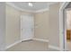 Neutral entryway featuring tile flooring, crown molding, and a white front door at 711 Providence Glen Dr, Chapel Hill, NC 27514