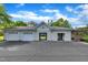 Spacious three car garage with an open breezeway to a covered lounge area at 711 Providence Glen Dr, Chapel Hill, NC 27514