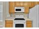 Close-up of a kitchen, complete with white appliances and light countertops, designed for functionality and ease of use at 711 Providence Glen Dr, Chapel Hill, NC 27514