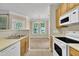 Bright, open layout from kitchen to dining, featuring neutral tones and ample lighting for a welcoming cooking and dining experience at 711 Providence Glen Dr, Chapel Hill, NC 27514