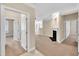 Open-concept living room with plush carpeting, fireplace, and neutral wall color at 711 Providence Glen Dr, Chapel Hill, NC 27514