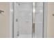 Close-up of a bright, clean shower with a glass door and white tiled walls at 711 Providence Glen Dr, Chapel Hill, NC 27514