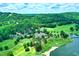 Stunning aerial view of the golf course and surrounding landscape, a golfer's paradise at 74002 Harvey, Chapel Hill, NC 27517
