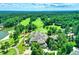 Golf course with trees, lake, and clubhouse offers a scenic and active lifestyle at 74002 Harvey, Chapel Hill, NC 27517