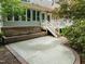 Backyard featuring a brick patio, concrete patio, and lush landscaping at 74002 Harvey, Chapel Hill, NC 27517
