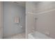 Bathroom featuring a shower/tub combination with tile surround and neutral walls at 74002 Harvey, Chapel Hill, NC 27517