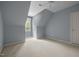 Attic bedroom with a dormer window, neutral carpeting, and light blue walls at 74002 Harvey, Chapel Hill, NC 27517
