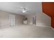 Spacious bonus room with a ceiling fan, a built-in wet bar, and neutral carpeting at 74002 Harvey, Chapel Hill, NC 27517