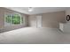 Bonus room featuring large windows, neutral carpeting, and a built-in wet bar at 74002 Harvey, Chapel Hill, NC 27517