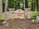 Stone entrance to Wilkinson Park surrounded by lush greenery, a welcoming neighborhood at 74002 Harvey, Chapel Hill, NC 27517