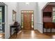 Elegant foyer with hardwood floors and wood paneled front door at 74002 Harvey, Chapel Hill, NC 27517