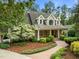 Charming home with inviting brick-and-siding facade and lush landscaping at 74002 Harvey, Chapel Hill, NC 27517