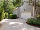 Spacious two-car garage features an automatic door and adjacent pedestrian door at 74002 Harvey, Chapel Hill, NC 27517