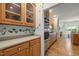Bright kitchen with wood cabinets, modern appliances, and open layout to a sunny breakfast nook at 74002 Harvey, Chapel Hill, NC 27517