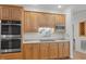 Updated kitchen with stainless steel appliances, wood cabinetry, and granite countertops at 74002 Harvey, Chapel Hill, NC 27517