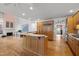 Kitchen featuring breakfast bar, wooden cabinets, and hardwood floors at 74002 Harvey, Chapel Hill, NC 27517