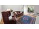 Bright living room with a plush sofa, area rug, and natural light at 74002 Harvey, Chapel Hill, NC 27517