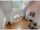 Spacious living room features hardwood floors, fireplace, and oversized windows for natural light at 74002 Harvey, Chapel Hill, NC 27517