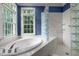 Bright bath with a soaking tub, separate shower, and a garden view window at 74002 Harvey, Chapel Hill, NC 27517