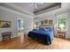 Cozy main bedroom with hardwood floors, tray ceilings, and natural lighting at 74002 Harvey, Chapel Hill, NC 27517