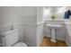Classic powder room with a pedestal sink and a crisp, clean aesthetic at 74002 Harvey, Chapel Hill, NC 27517