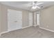 Large neutral bedroom with ample closet space and a door to hall at 8113 Huskfield Ct, Apex, NC 27539