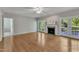 Spacious living room with hardwood floors, fireplace, and natural light from french doors at 8113 Huskfield Ct, Apex, NC 27539