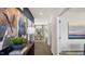 Inviting hallway showcasing wood floors and modern decor, leading to a bright dining area with large windows at 816 Bullhorn Dr, Wake Forest, NC 27587