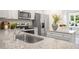 Bright kitchen featuring granite countertops, stainless steel appliances, a breakfast bar, and white cabinetry at 8538 Beckett Chase Way, Raleigh, NC 27616