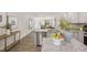 Bright, open kitchen with granite countertops, stainless steel appliances, and seamless flow to the dining area at 8540 Beckett Chase Way, Raleigh, NC 27616