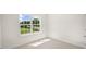 Cozy bedroom with a large window overlooking the front yard at 8550 Beckett Chase Way, Raleigh, NC 27616