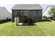 Expansive backyard with a deck and stairs, ideal for outdoor entertaining and leisure at 870 Live Oak Ln, Nashville, NC 27856