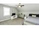 A bright bedroom featuring neutral walls and a ceiling fan with an integrated lighting fixture at 870 Live Oak Ln, Nashville, NC 27856